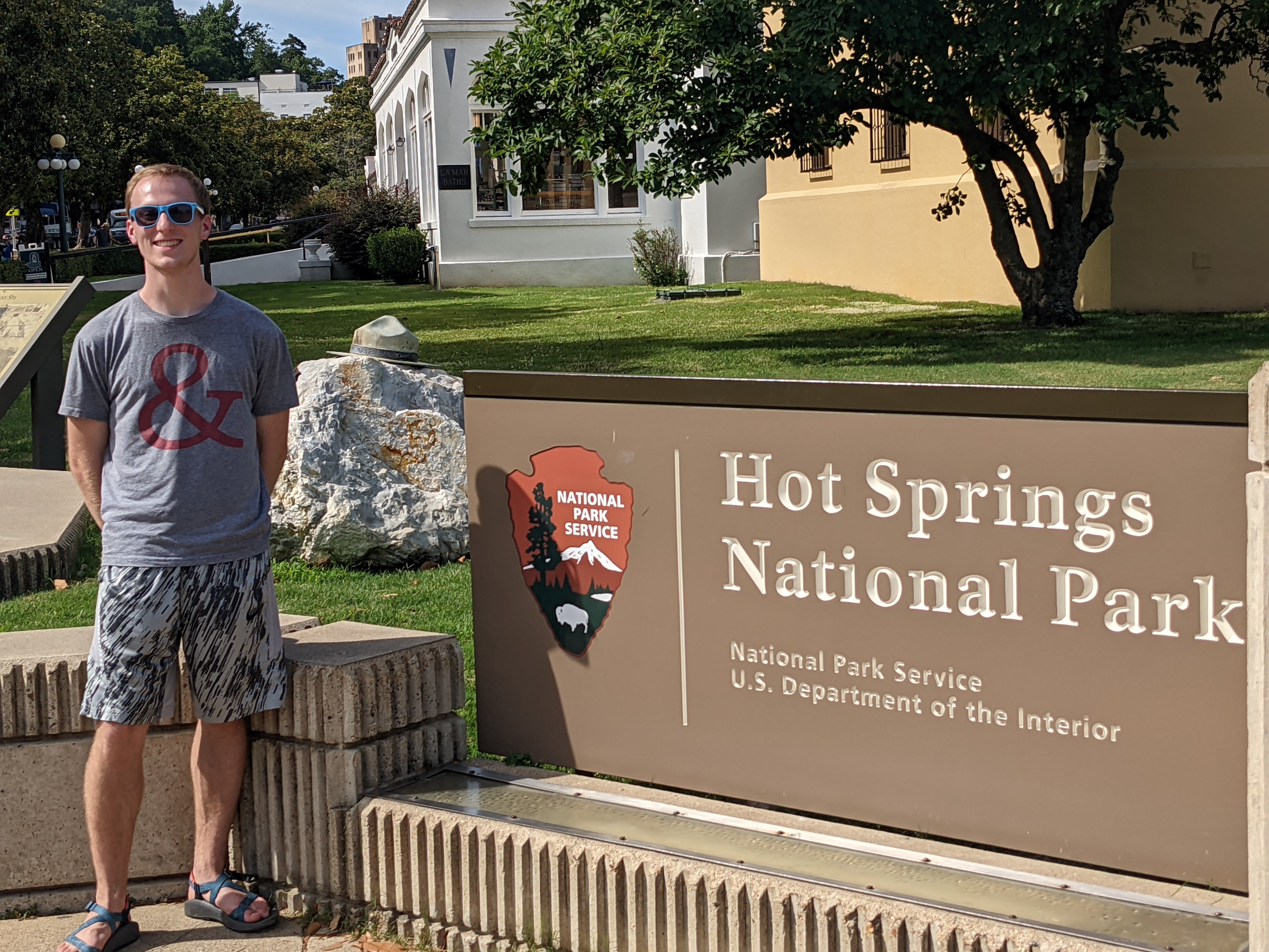 Kyle in front of Hot Springs National Park sign